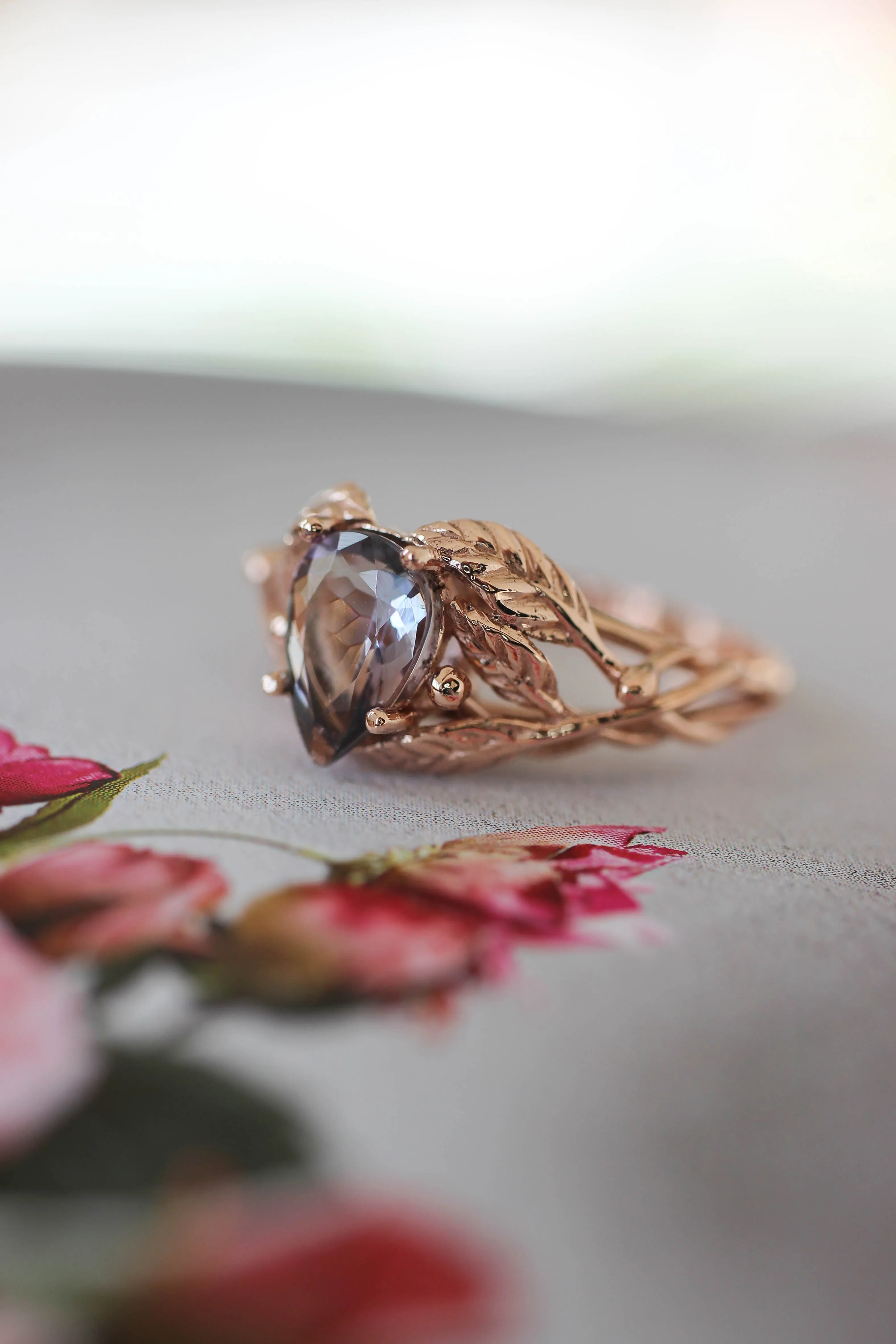 Tanzanite engagement ring, leaves ring with pear cut gemstone